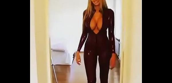  Sexy babe walks in latex catsuit